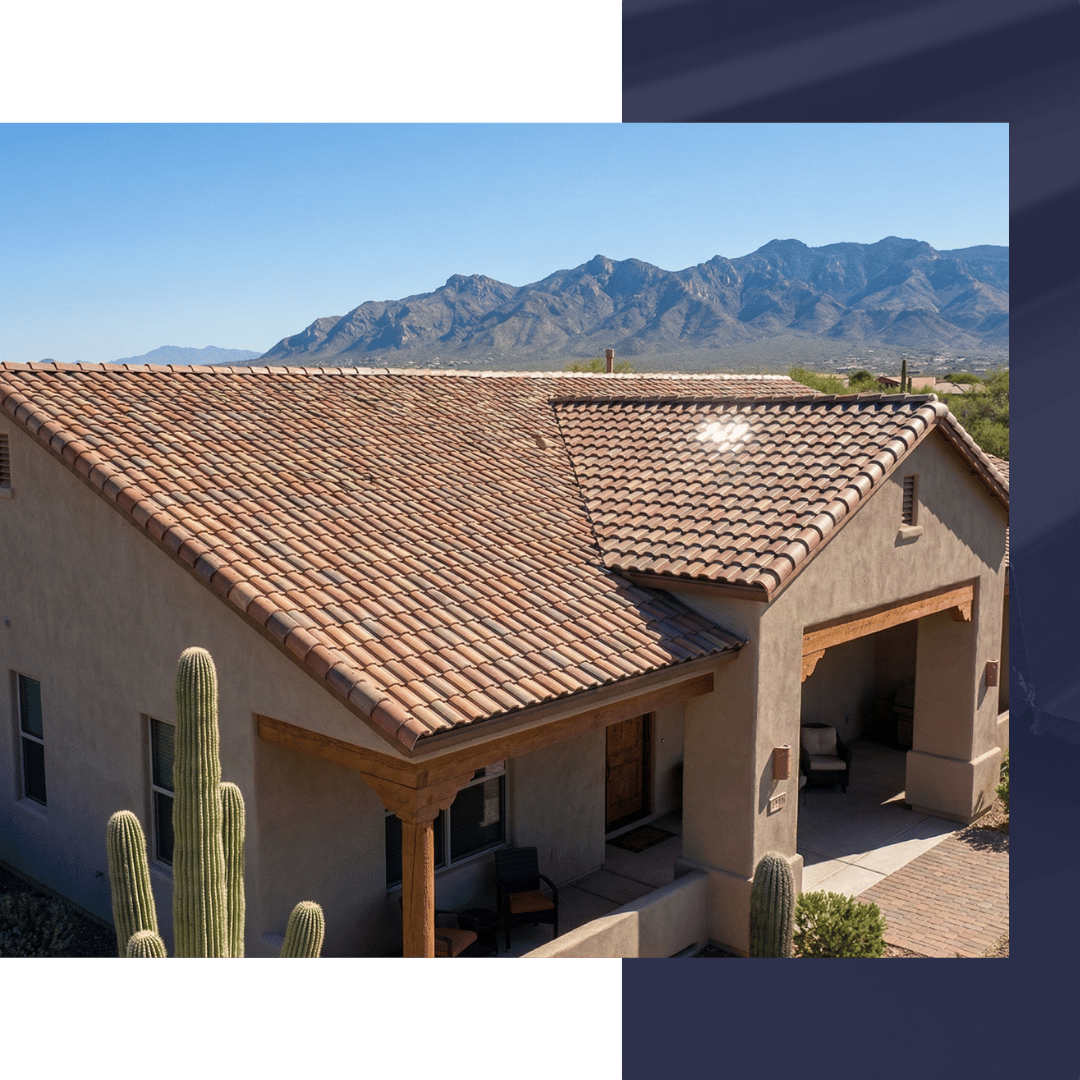 Wide-angle view of a clean, tan concrete tile roof on a Southwest-style home with the Tortolita Mountains in the background.