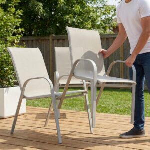 man stacking patio chairs
