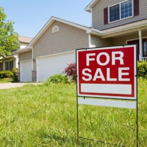 For Sale sign in front of residential property